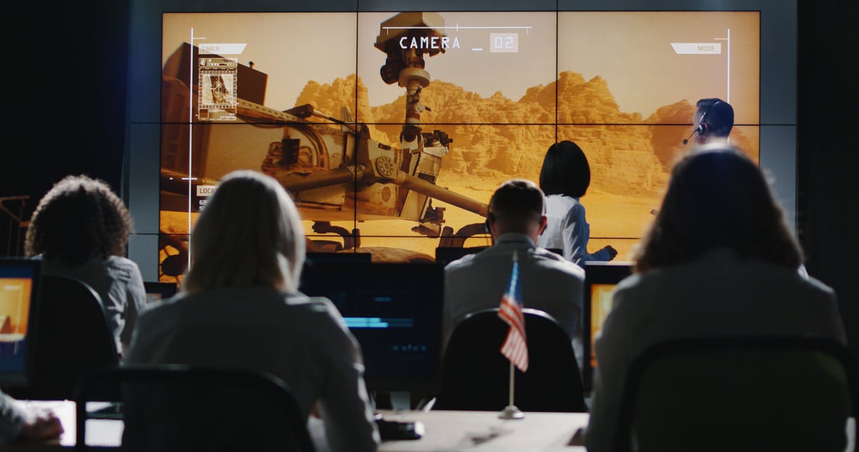 Mission leader giving briefing in control room